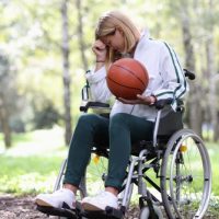 Disabled20woman20in20wheelchair20holding20basketball20ball20and20crying.jpg