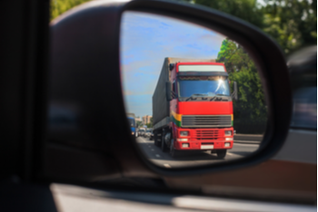 18 wheel truck in rearview mirror